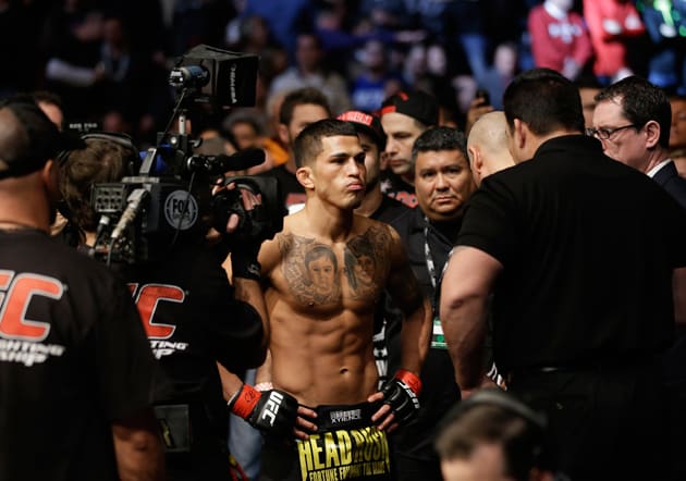 Anthony Pettis checks before fighting with Donald Cerrone during UFC Lightweight Championship on FOX 6 at the United Center in Chicago, Saturday, Jan. 26, 2013. Pettis won the bout.